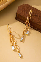 Paperclip Chain Dangle Design: Features double-strand paperclip link chains dangling in asymmetrical lengths for fluid movement.