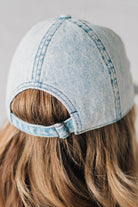 Blonde woman wearing a US Flag Monochomatic Embossed Baseball Ball Cap.