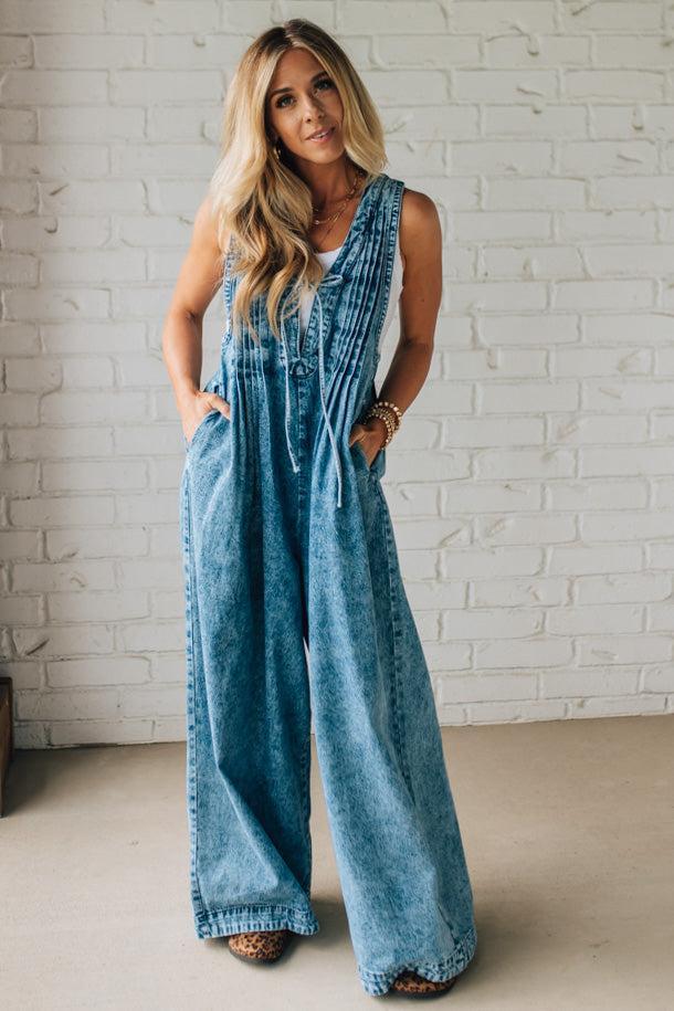 Blonde Woman Wearing a Mineral Washed Pintuck Jumpsuit With Side Pockets.