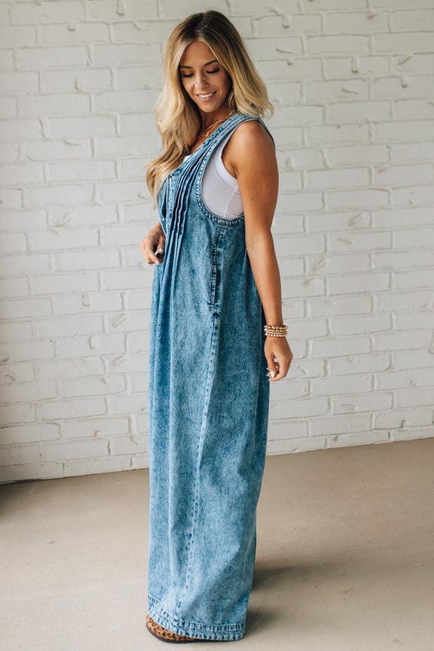 Blonde Woman Wearing a Mineral Washed Pintuck Jumpsuit With Side Pockets.