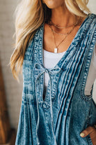 Blonde Woman Wearing a Mineral Washed Pintuck Jumpsuit With Side Pockets.