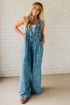 Blonde Woman Wearing a Mineral Washed Pintuck Jumpsuit With Side Pockets.