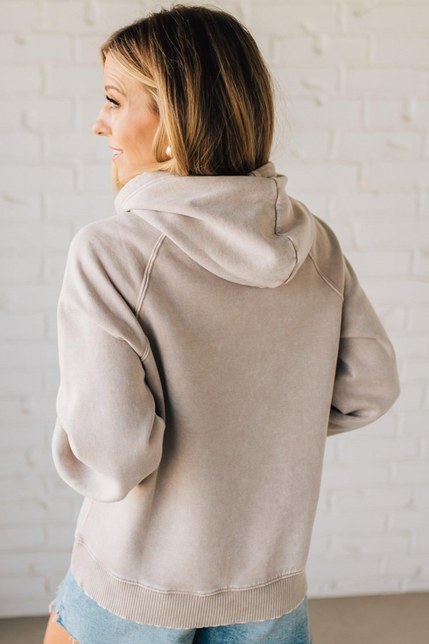 Blonde Woman Wearing a Solid Acid Wash Fleece Hoodie With Front Pocket