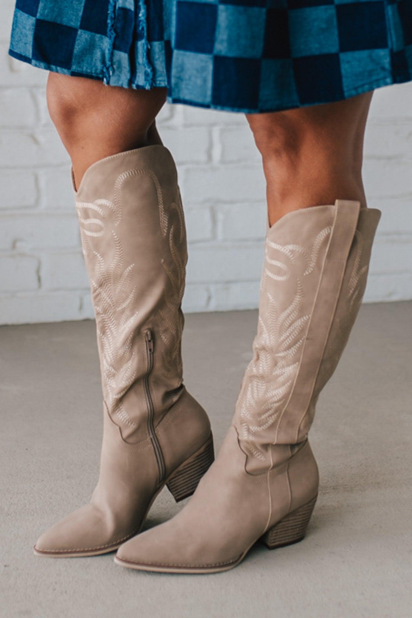 Knee Height light tan embroidered western style boots.