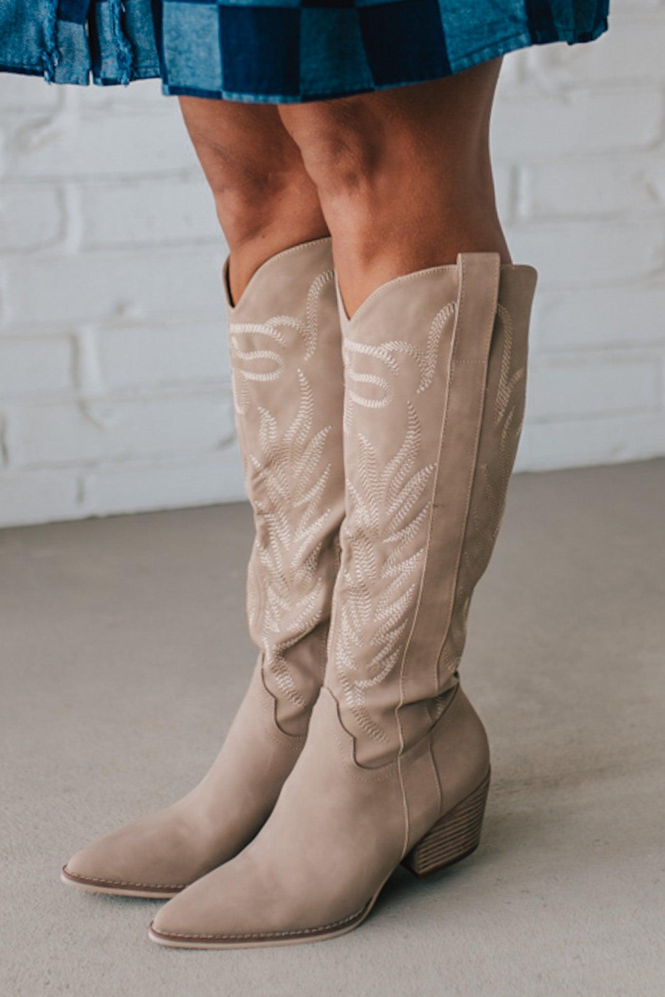 Knee Height light tan embroidered western style boots.