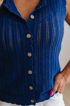 Blue ribbed knit cardigan with buttons on a white background