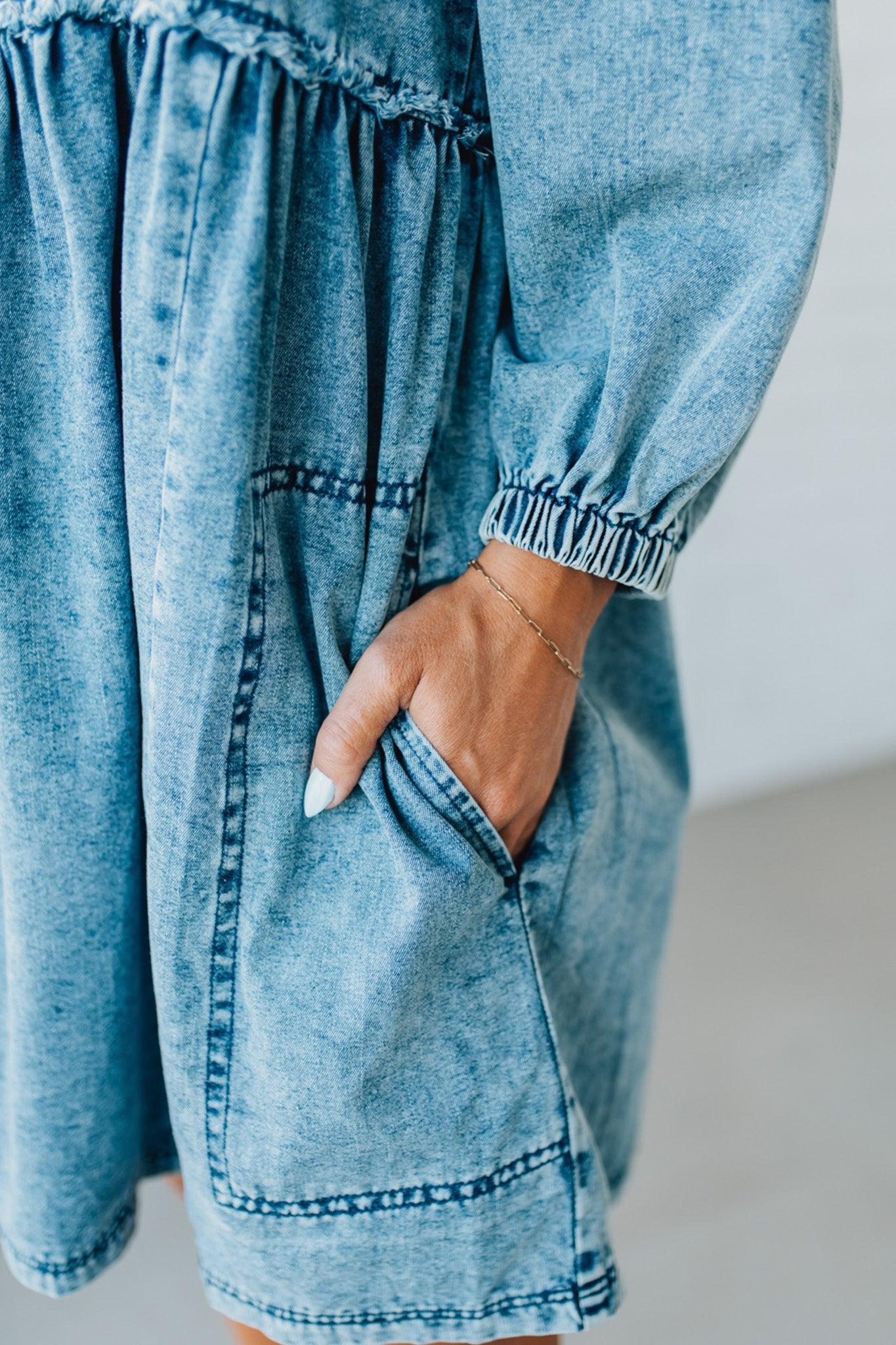 Blonde Woman Wearing a Washed And Distressed Mini Denim Dress