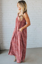 Blonde woman wearing a red Paisley Print Maxi Dress With Adjustable Straps.