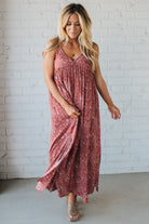 Blonde woman wearing a red Paisley Print Maxi Dress With Adjustable Straps.