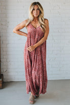 Blonde woman wearing a red Paisley Print Maxi Dress With Adjustable Straps.