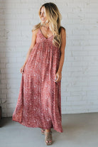 Blonde woman wearing a red Paisley Print Maxi Dress With Adjustable Straps.