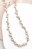 Delicate Gold Wire & Bead Accents: Features fine gold-tone wire connections accented with small polished gold bead spacers for a light, floating effect.