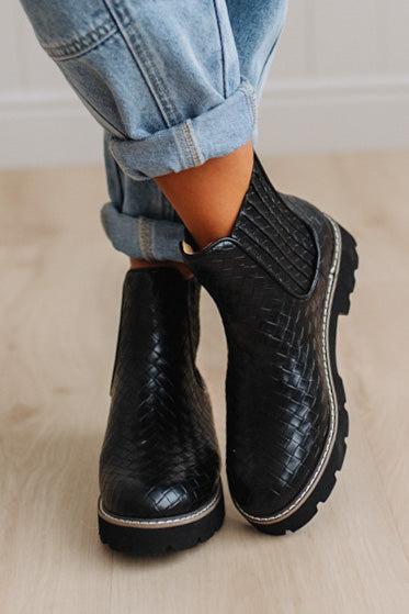 Black classic Chelsea silhouette with a woven, intrecciato-inspired finish and bold lug sole, crafted from atelier-selected materials. Grounded by our signature DreamCloud cushioned sole