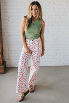Blonde Woman Wearing Stretch Floral Print Straight Leg Denim Jeans.