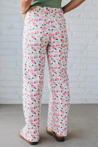 Blonde Woman Wearing Stretch Floral Print Straight Leg Denim Jeans.