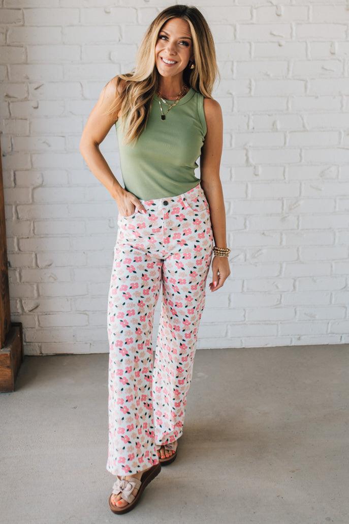 Blonde Woman Wearing Stretch Floral Print Straight Leg Denim Jeans.