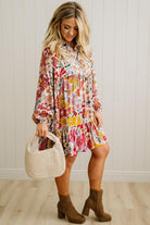 Woman wearing a floral dress with a white background