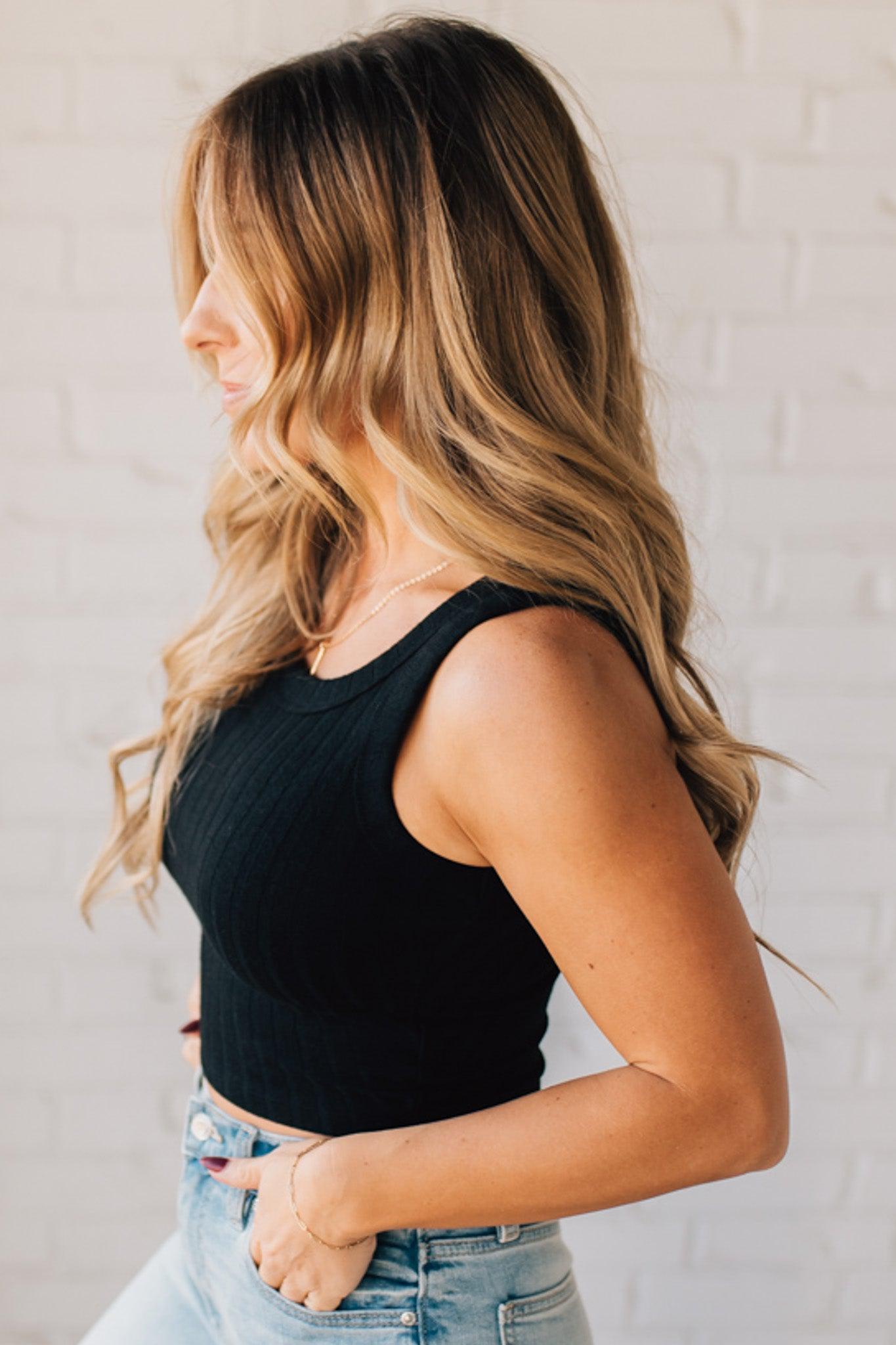 Blonde girl modeling a solid ribbed cropped tank