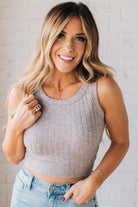 Blonde girl modeling a solid ribbed cropped tank