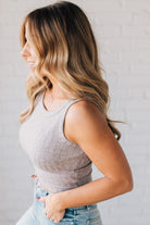 Blonde girl modeling a solid ribbed cropped tank