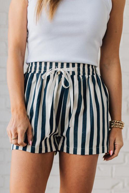 Blonde Woman Wearing Stripe Twill Shorts with Elastic Waist and Drawstring.