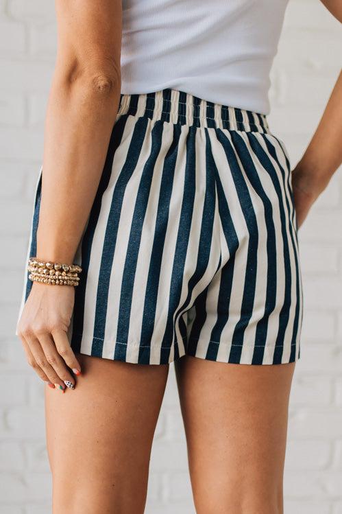 Blonde Woman Wearing Stripe Twill Shorts with Elastic Waist and Drawstring.