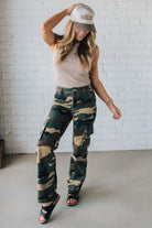 Blonde Woman in a Tan Tank Wearing Camouflage Mid Rise Cargo Straight Pants.