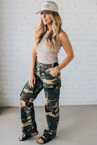 Blonde Woman in a Tan Tank Wearing Camouflage Mid Rise Cargo Straight Pants.