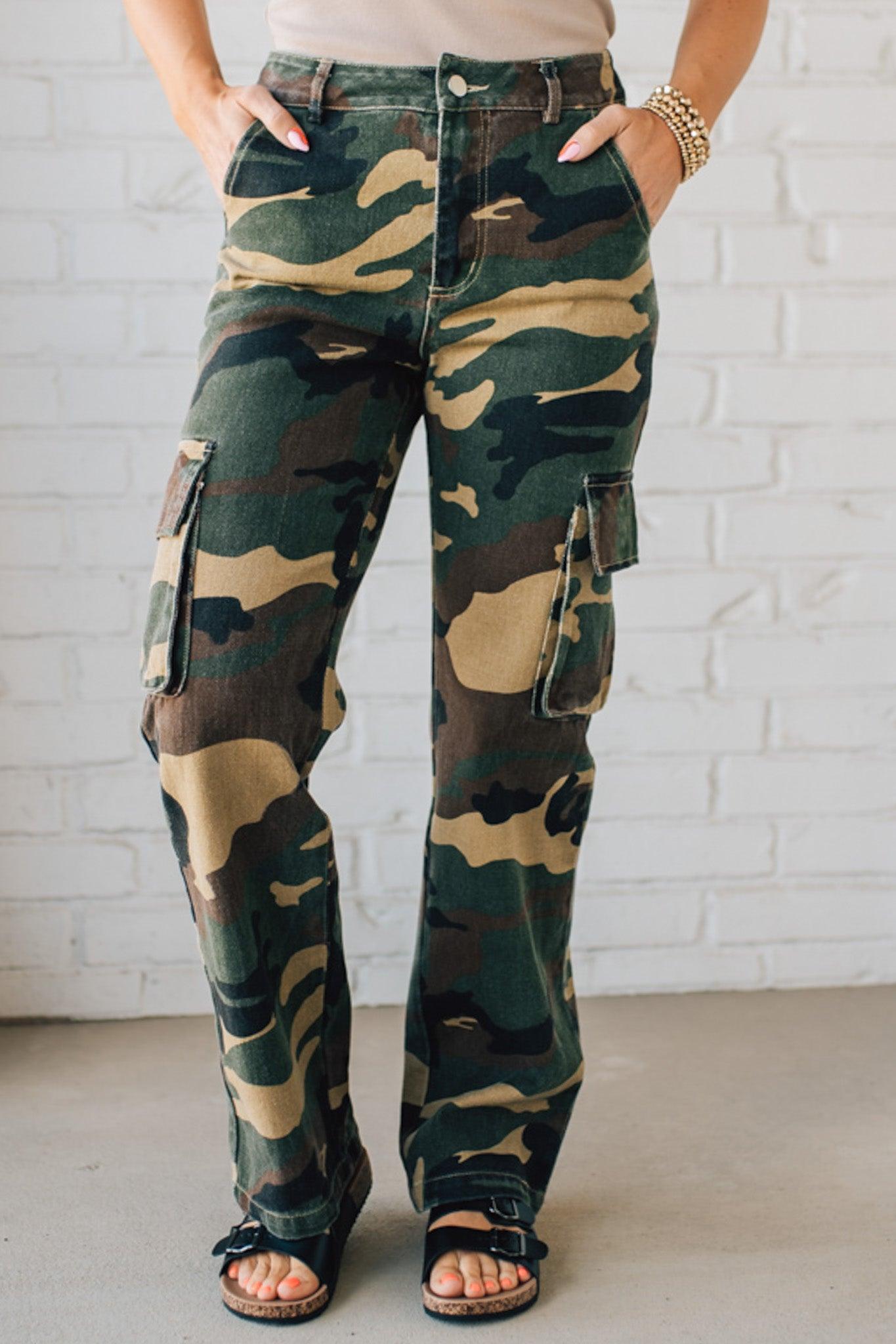 Blonde Woman in a Tan Tank Wearing Camouflage Mid Rise Cargo Straight Pants.