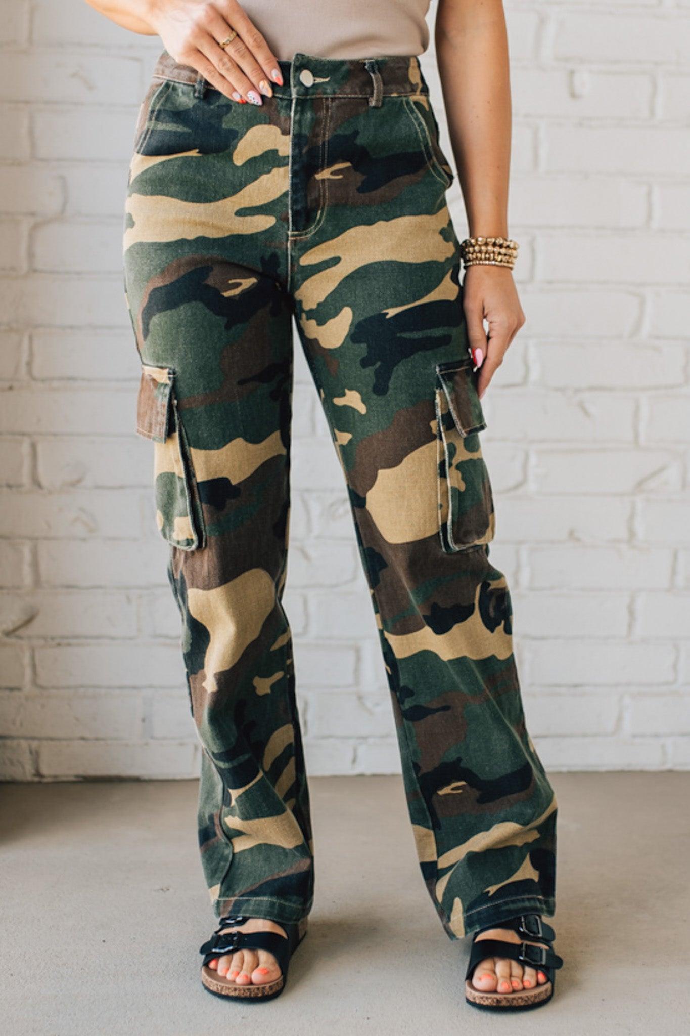 Blonde Woman in a Tan Tank Wearing Camouflage Mid Rise Cargo Straight Pants.