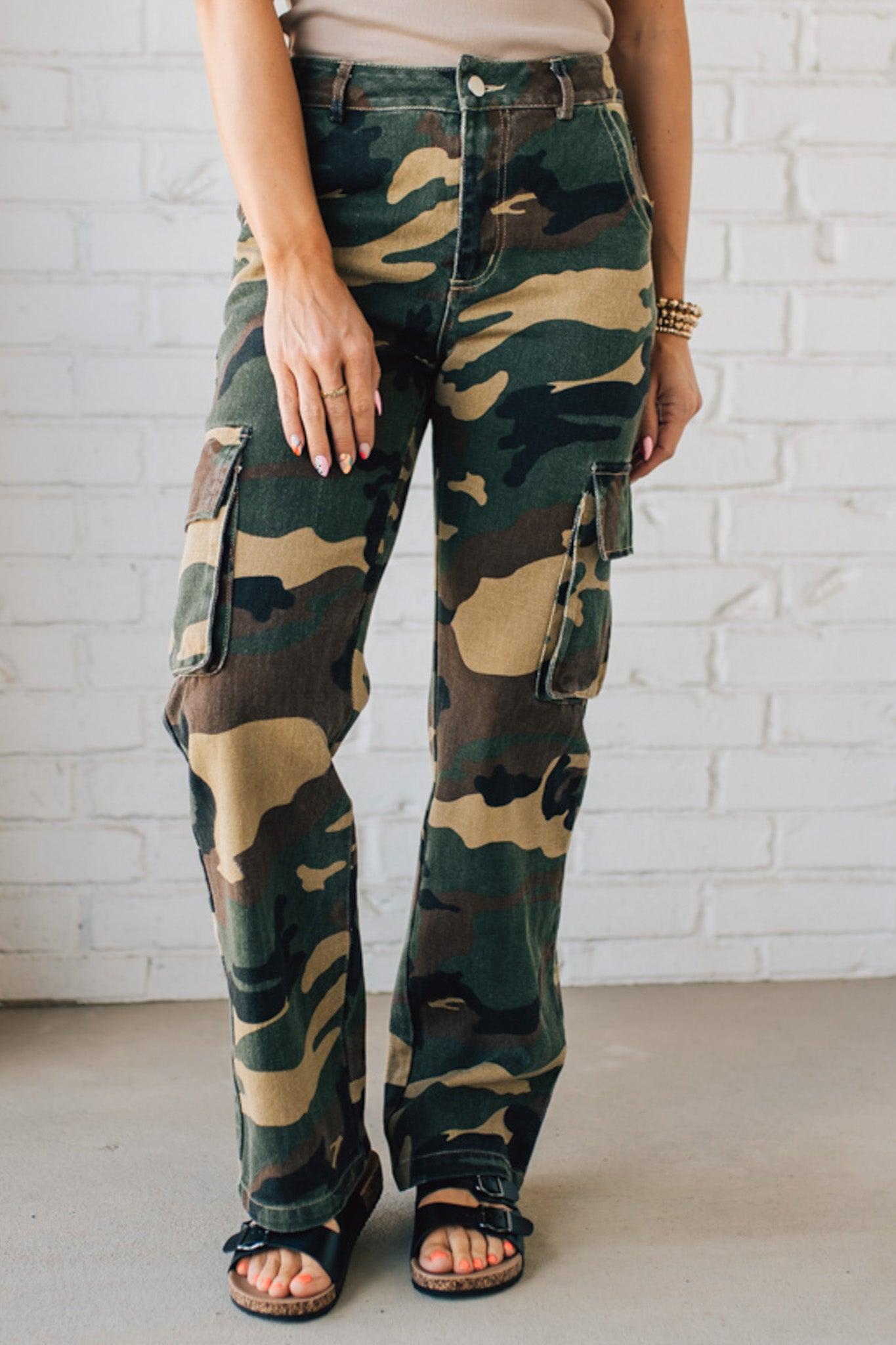 Blonde Woman in a Tan Tank Wearing Camouflage Mid Rise Cargo Straight Pants.