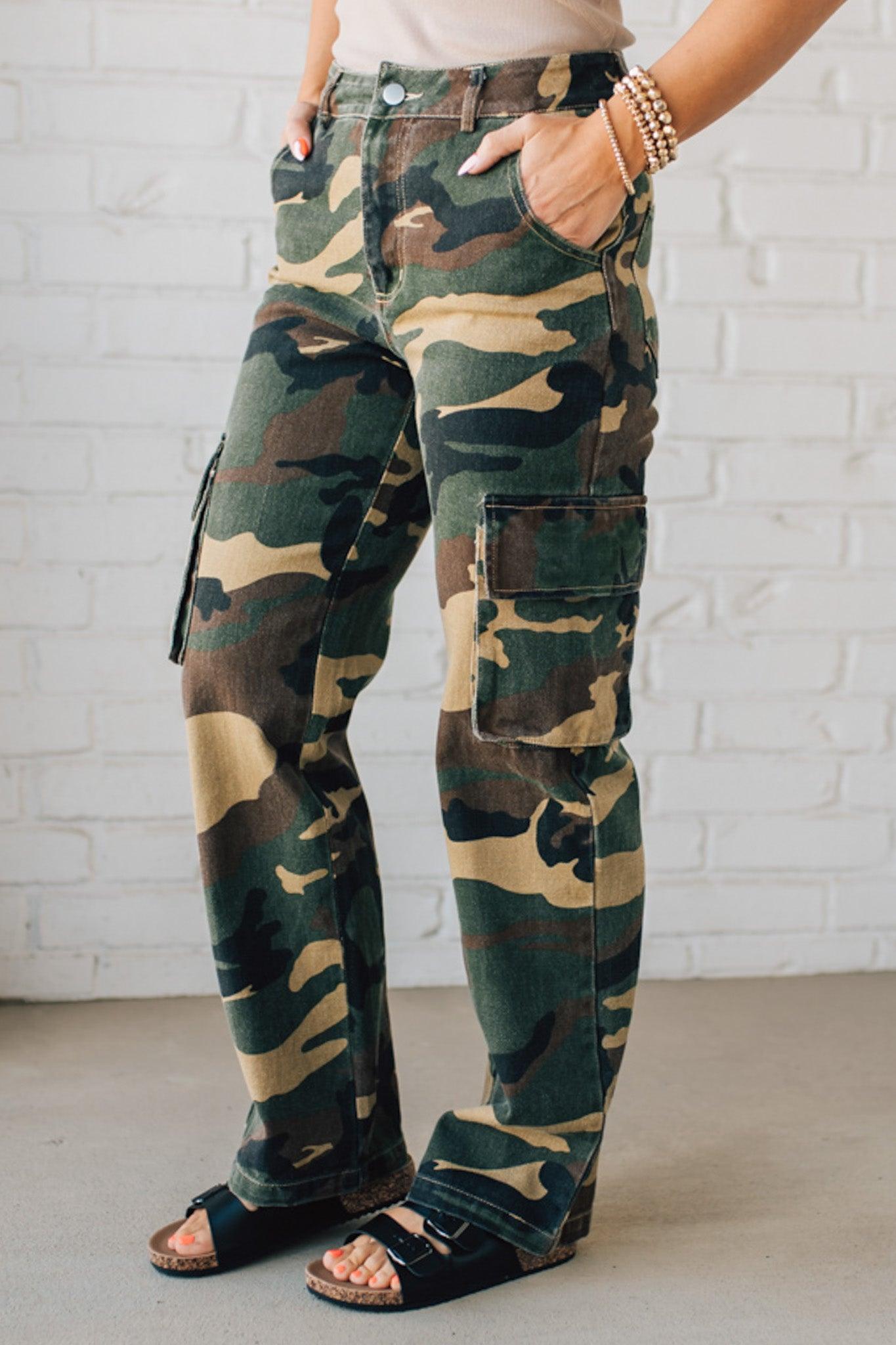 Blonde Woman in a Tan Tank Wearing Camouflage Mid Rise Cargo Straight Pants.