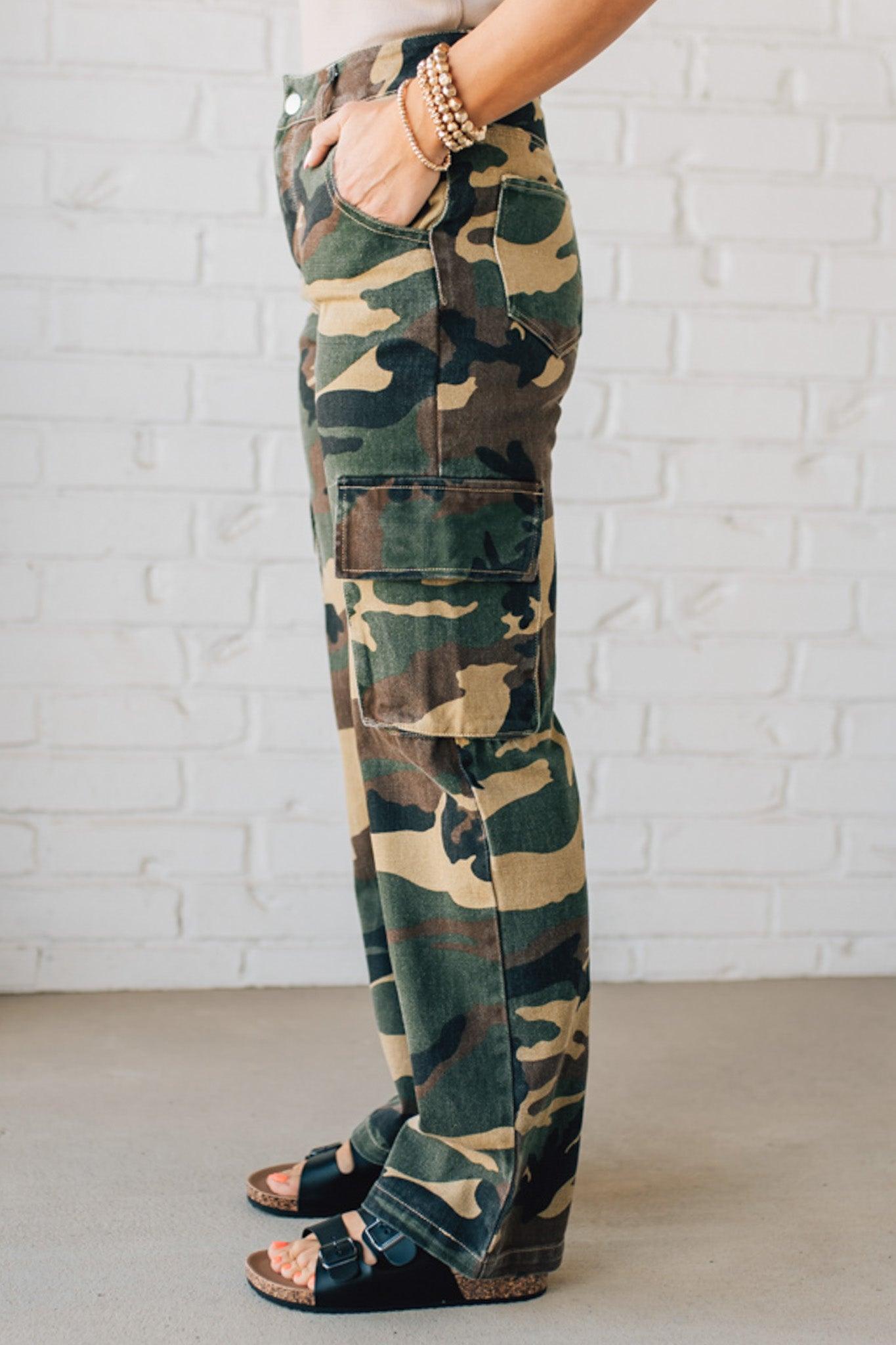 Blonde Woman in a Tan Tank Wearing Camouflage Mid Rise Cargo Straight Pants.