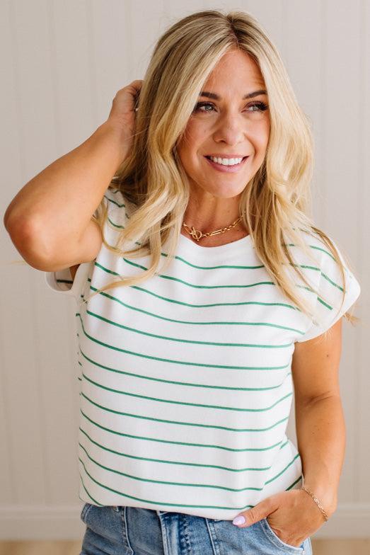 BLONDE WOMAN WEARING A STRIPED, CREW NECK, EXTENDED DOLMAN SHORT SLEEVE, EVERYDAY SWEATER TOP, IN IVORY WITH THIN KELLY GREEN STRIPE