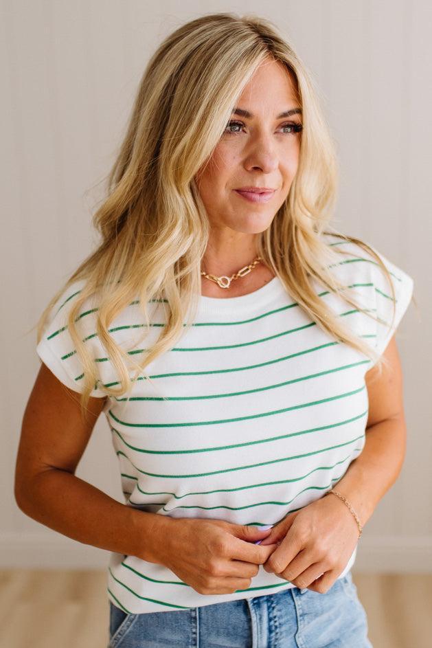 BLONDE WOMAN WEARING A STRIPED, CREW NECK, EXTENDED DOLMAN SHORT SLEEVE, EVERYDAY SWEATER TOP, IN IVORY WITH THIN KELLY GREEN STRIPE
