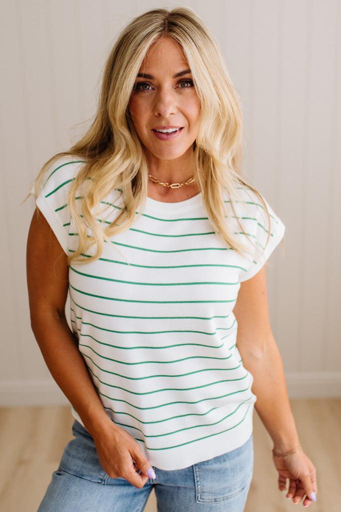 BLONDE WOMAN WEARING A STRIPED, CREW NECK, EXTENDED DOLMAN SHORT SLEEVE, EVERYDAY SWEATER TOP, IN IVORY WITH THIN KELLY GREEN STRIPE