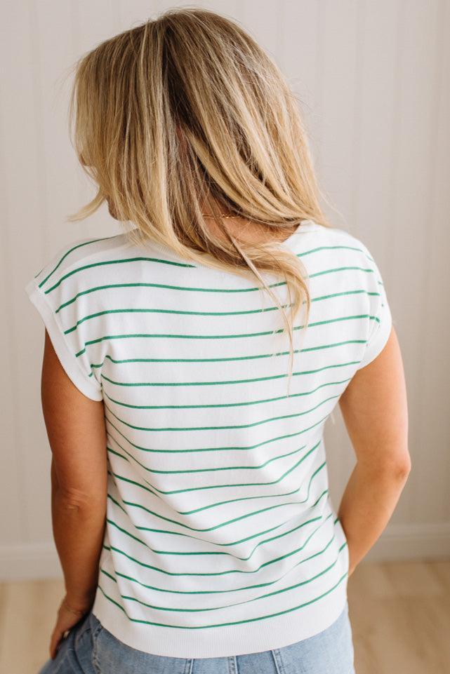 BLONDE WOMAN WEARING A STRIPED, CREW NECK, EXTENDED DOLMAN SHORT SLEEVE, EVERYDAY SWEATER TOP, IN IVORY WITH THIN KELLY GREEN STRIPE