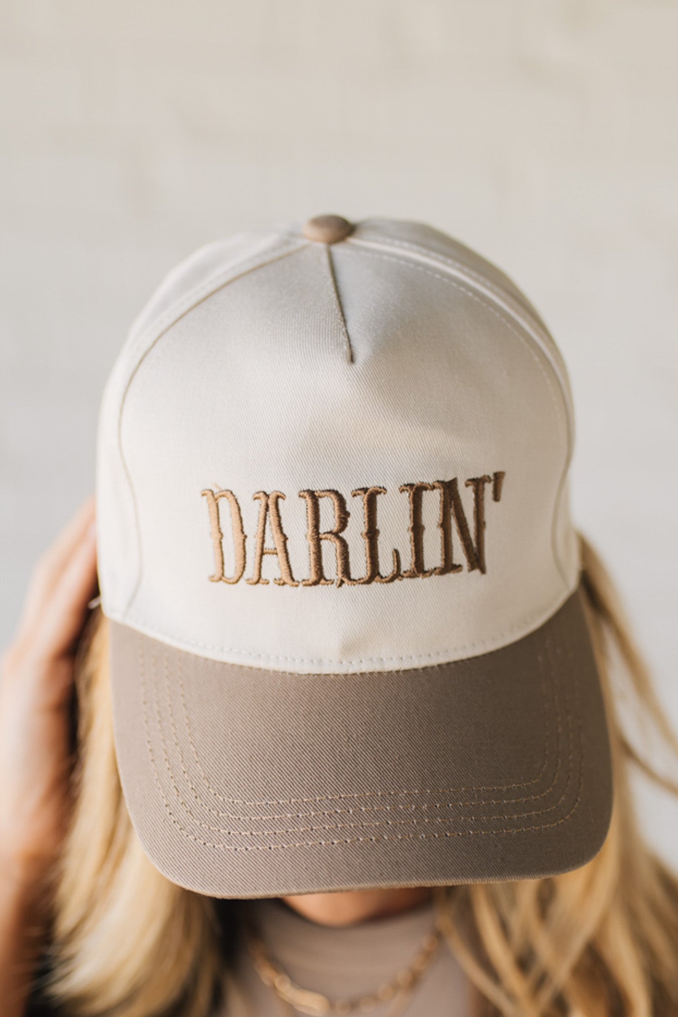 Blonde woman wearing a Darlin' Embroidered Two-tone Canvas Cotton Cap