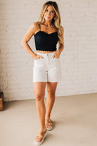Blonde Woman Wearing a Seamless Lace Bralette With Bra Pads with Ribbed Texture and Eyelet Lace.