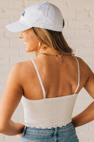 Blonde Woman Wearing a Seamless Lace Bralette With Bra Pads with Ribbed Texture and Eyelet Lace.