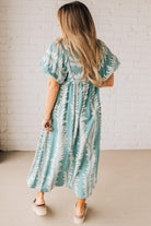 Blonde woman wearing a Printed Short Puff Sleeve Midi Dress with a Smocked Front Yoke.