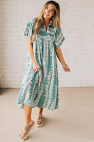 Blonde woman wearing a Printed Short Puff Sleeve Midi Dress with a Smocked Front Yoke.