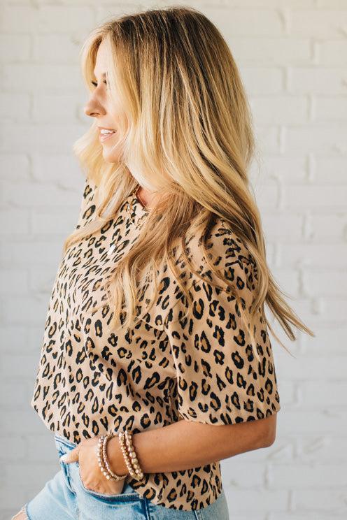 Blonde Woman Wearing a Loose Fit Leopard Print Round Neck Knit Top.