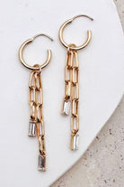 Paperclip Chain Dangle Design: Features double-strand paperclip link chains dangling in asymmetrical lengths for fluid movement.