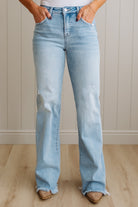 Light blue jeans worn by a person against a neutral background