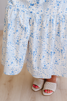 Floral dress with blue flowers on a white background