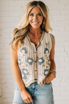 Blonde woman wearing a Floral Embroidery Patch Crochet Sweater Vest in cream, with mocha and dusty blue weave.