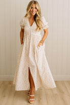 Woman wearing a floral dress with a white background