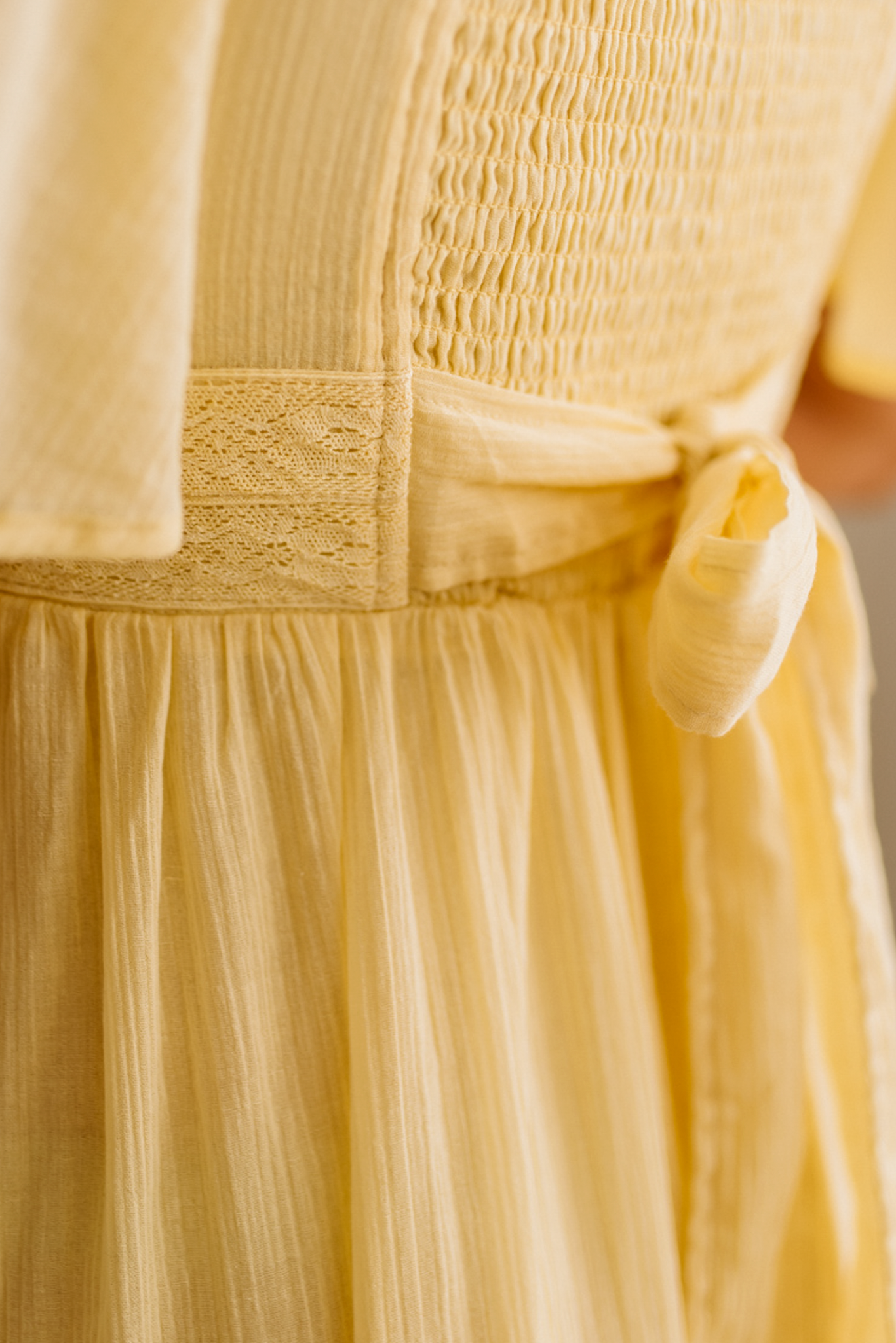 Blonde Woman Wearing a Lemon Yellow Lace Inset Flutter Sleeve Maxi Dress