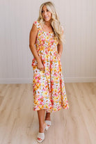 DARLING FLORAL MAXI DRESS FEATURES:
- COTTON FLORAL PRINT FABRICATION
- FLORAL EMBROIDERY MOTIF AT FRONT BUST
- RUFFLED SHOULDERS
- HIDDEN SIDE ZIPPER
- SIDE POCKETS
- SMOCKED BACK BODICE
- LACE INSET FLOUNCE
- FULL LINING